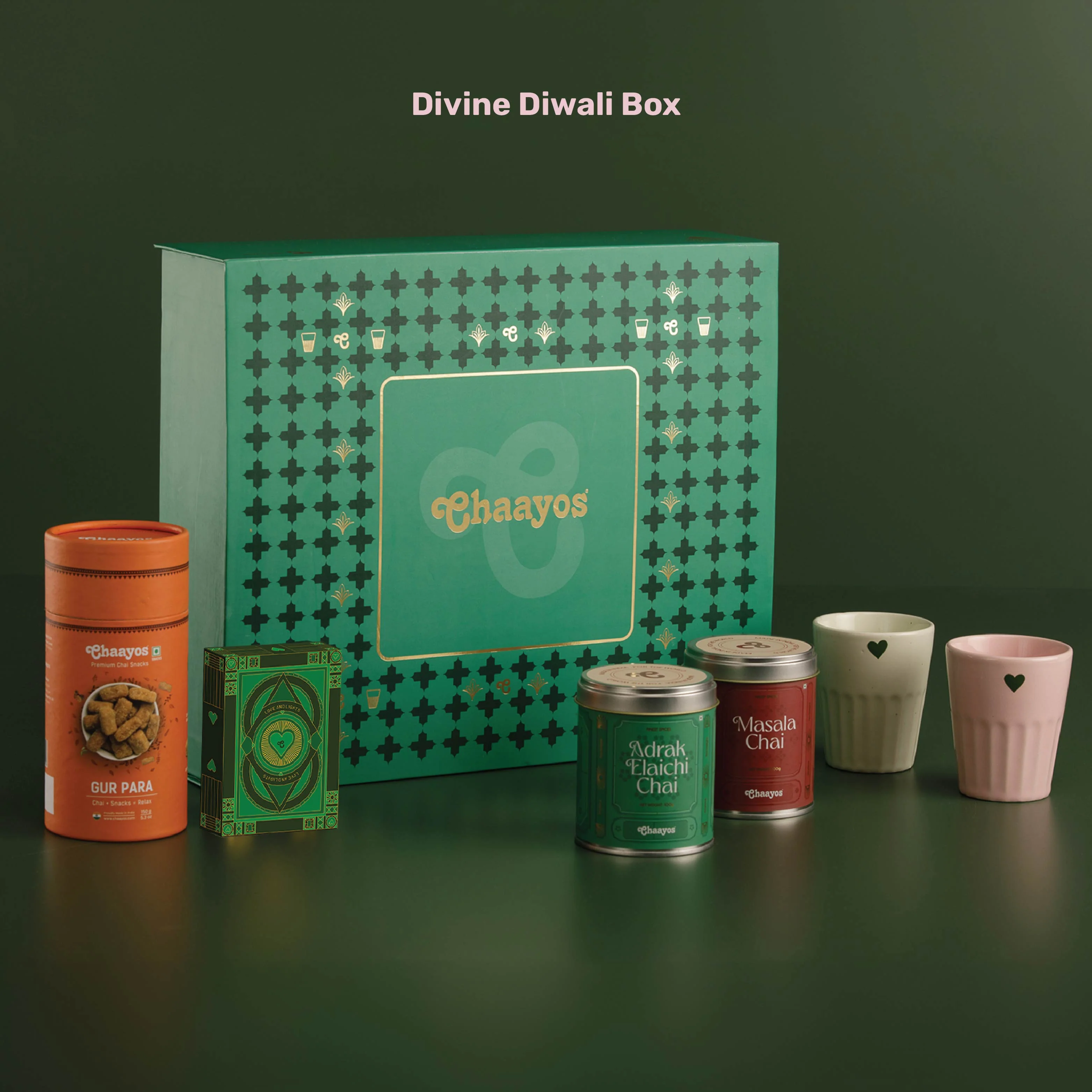Chaayos Divine Diwali Gift Box | Diwali gift Hamper with that includes Chai tin (Masala chai & Adrak Elaichi), 2 Ceramic Kulhads (Pink & Green), Set of 2 Diyas, Diwali Playing Cards, Gur Para for Family & Friends | Premium Diwali Gift Set - Image 5